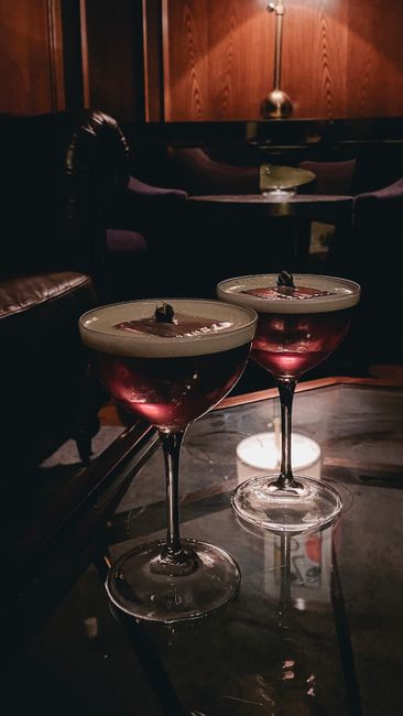 Two elegant cocktails on a stylish lounge table in Minsk Bar, Belarus.
