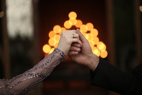 Free Two People Holding Hands Stock Photo