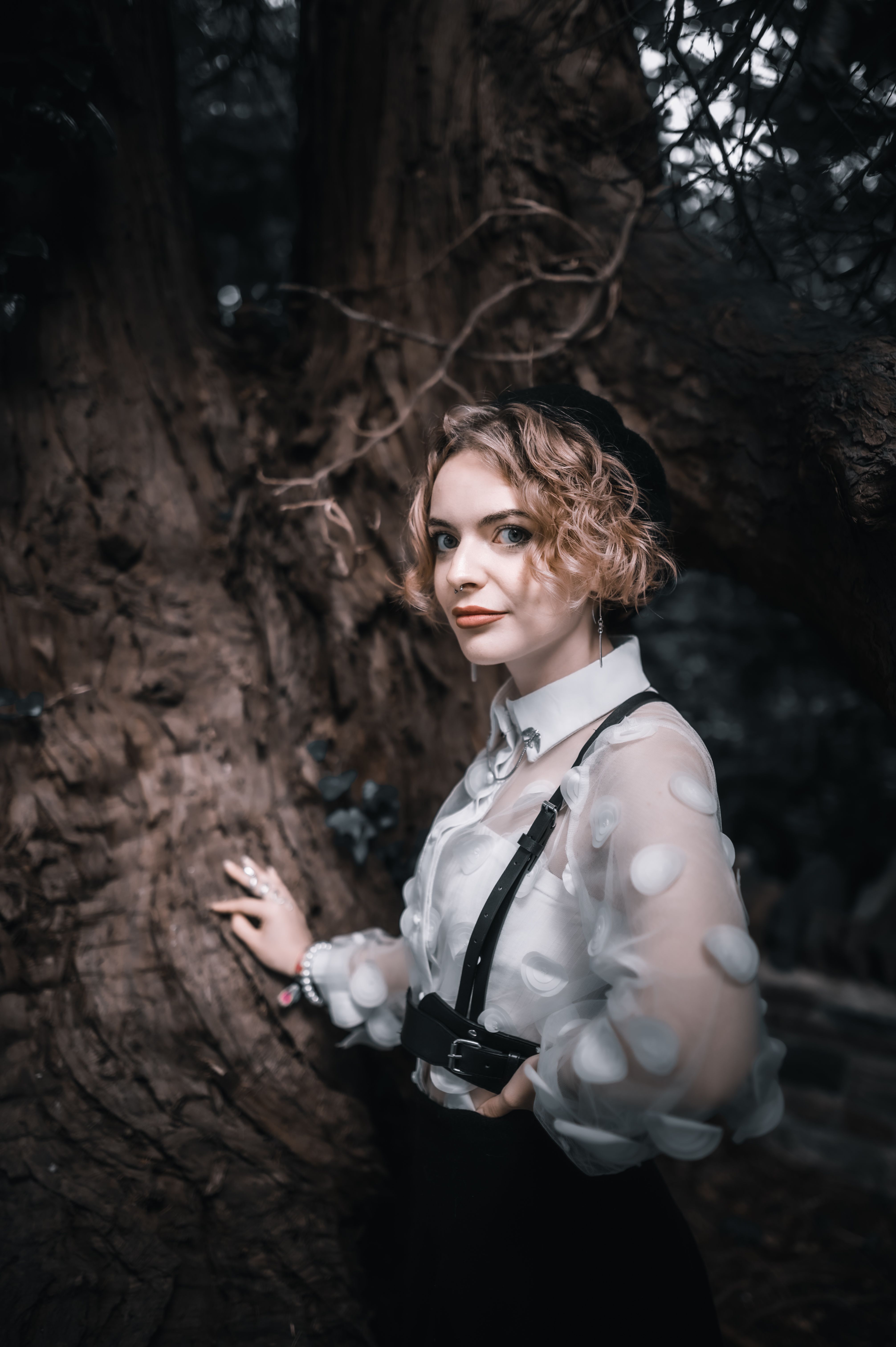 A Woman in White Dress Shirt Beside Brown Tree · Free Stock Photo