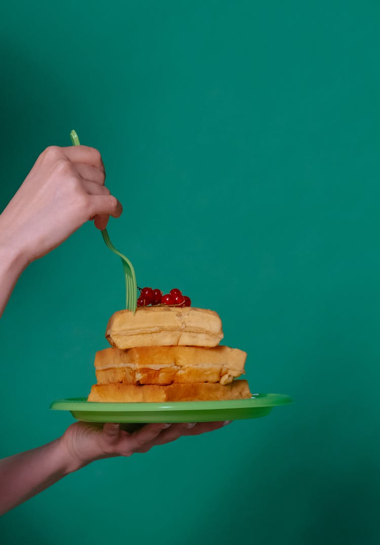 Woman Eating Fluffy Waffles With Fork