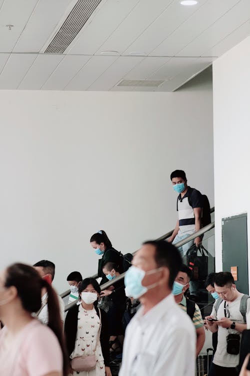 People Wearing Face Masks in a Building