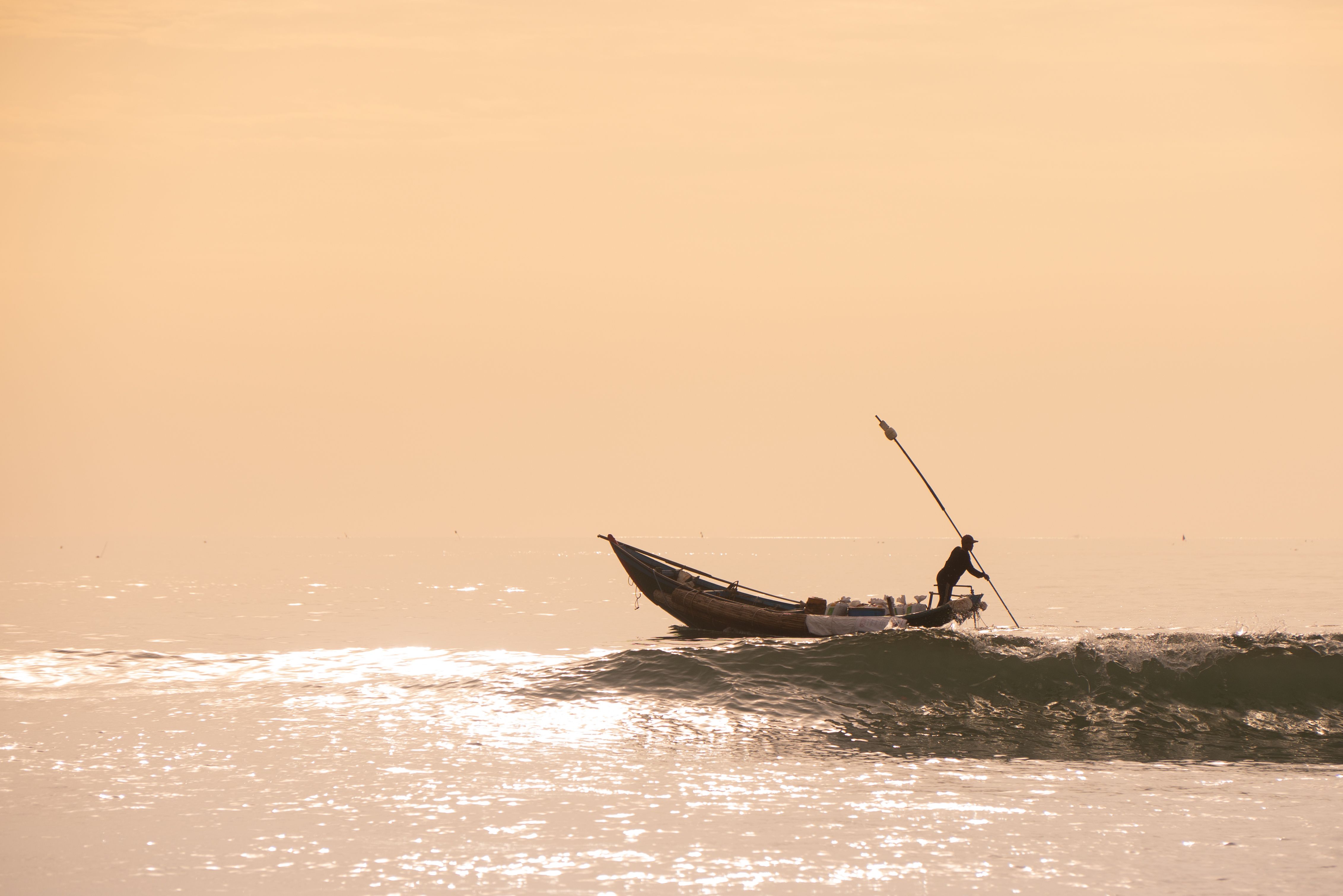 A Man Riding on Boat on Sea · Free Stock Photo