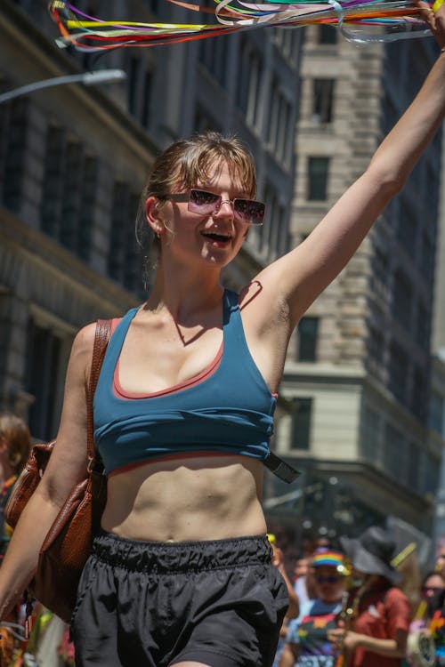 Free Woman in Blue Sports Bra and Black Sunglasses Stock Photo