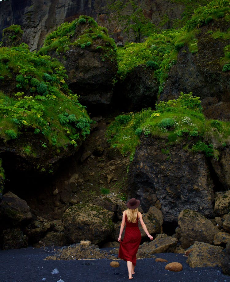 A Woman In Red Dress In The River