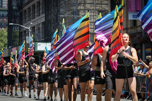 Parade Goers Carry Rainbow Flags during the NYC Pride 