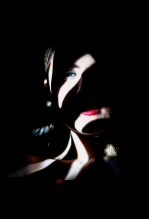 Portrait with dramatic shadow play — photo by Milad Mohammadi on Pexels