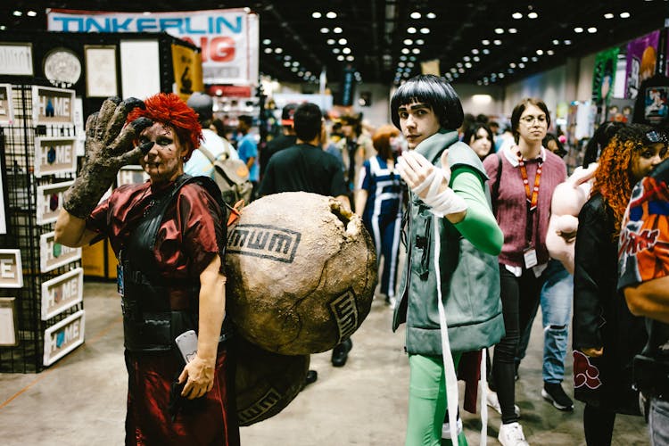 Men Cosplaying Gaara And Lee