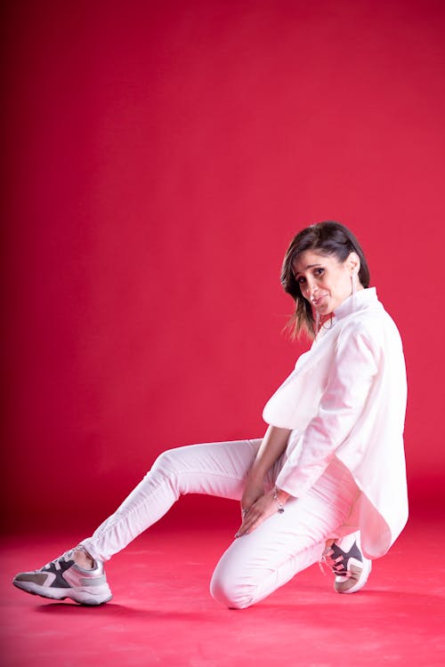 A Woman Wearing White Long Sleeves and White Pants 