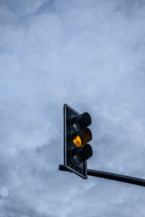 Traffic Light under Cloudy Sky 