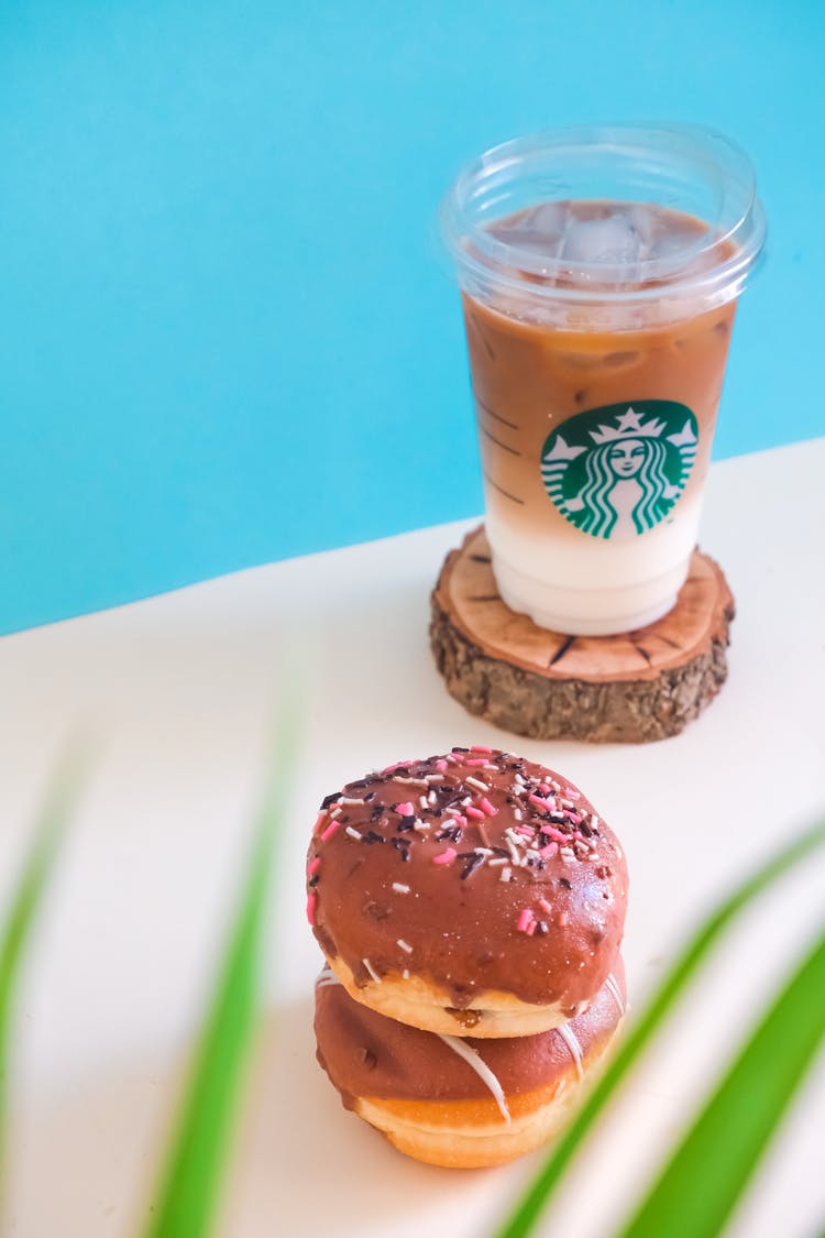 Stacked Doughnuts And Iced Coffee