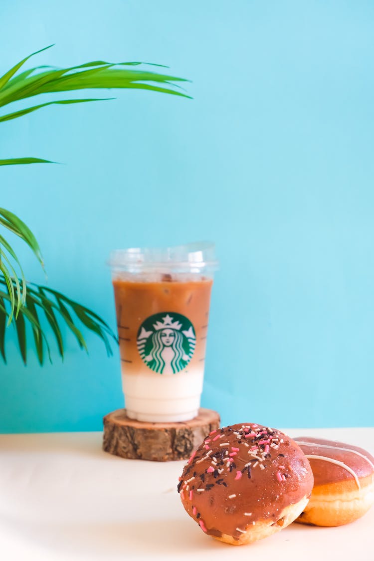 Chocolate Glazed Doughnuts And Iced Coffee