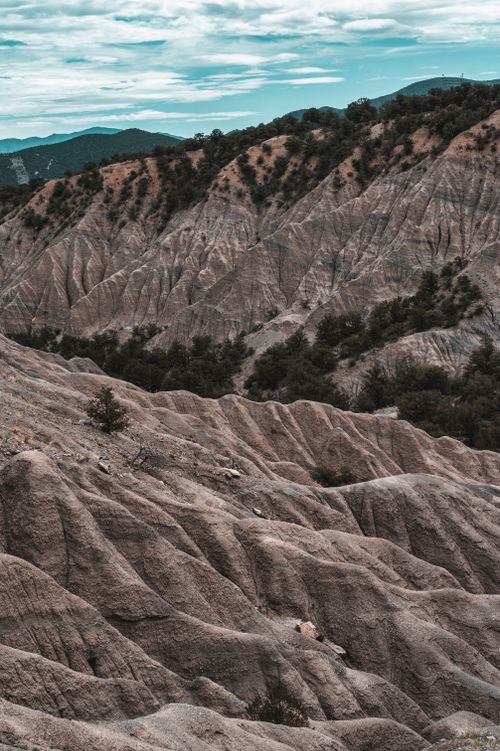 Free Explore the stunning eroded rock formations in a highland landscape, showcasing unique geological features. Stock Photo
