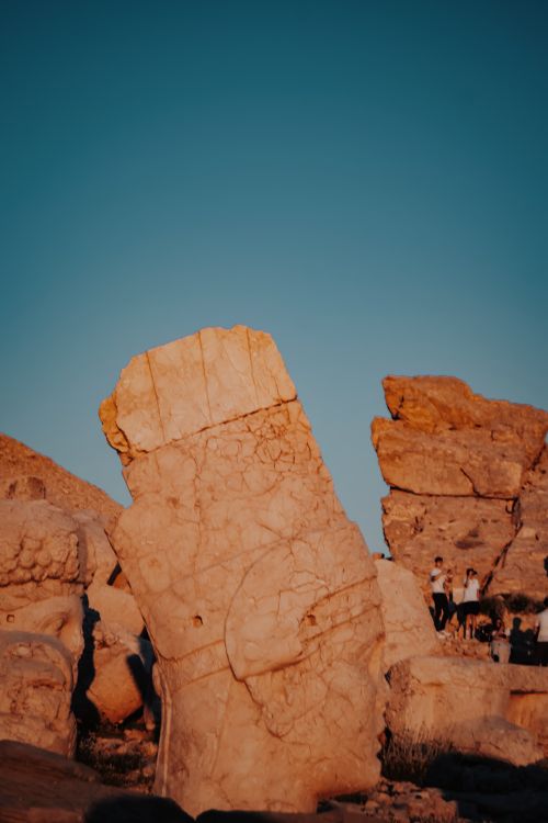 Free Ancient stone statue at sunset in Adıyaman, Turkey, showcasing rich archeological heritage. Stock Photo
