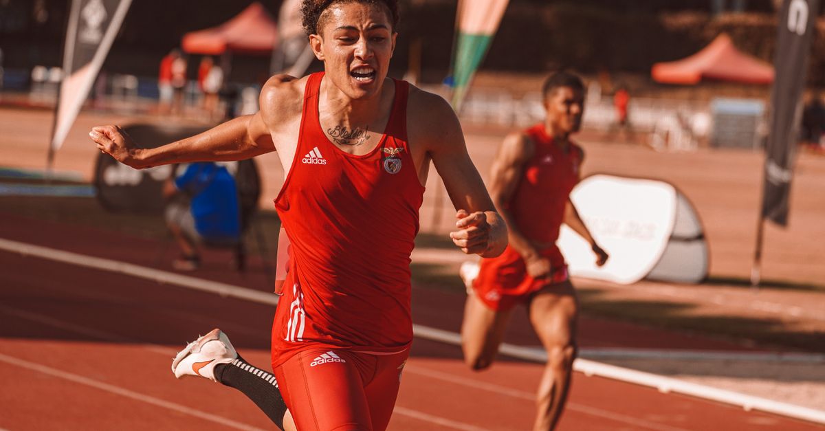 athlete crossing finish line in dramatic upset victory