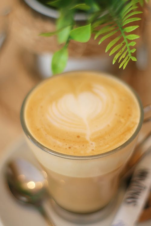 Free Close-Up Shot of Latte Art Coffee in Clear Glass Mug Stock Photo