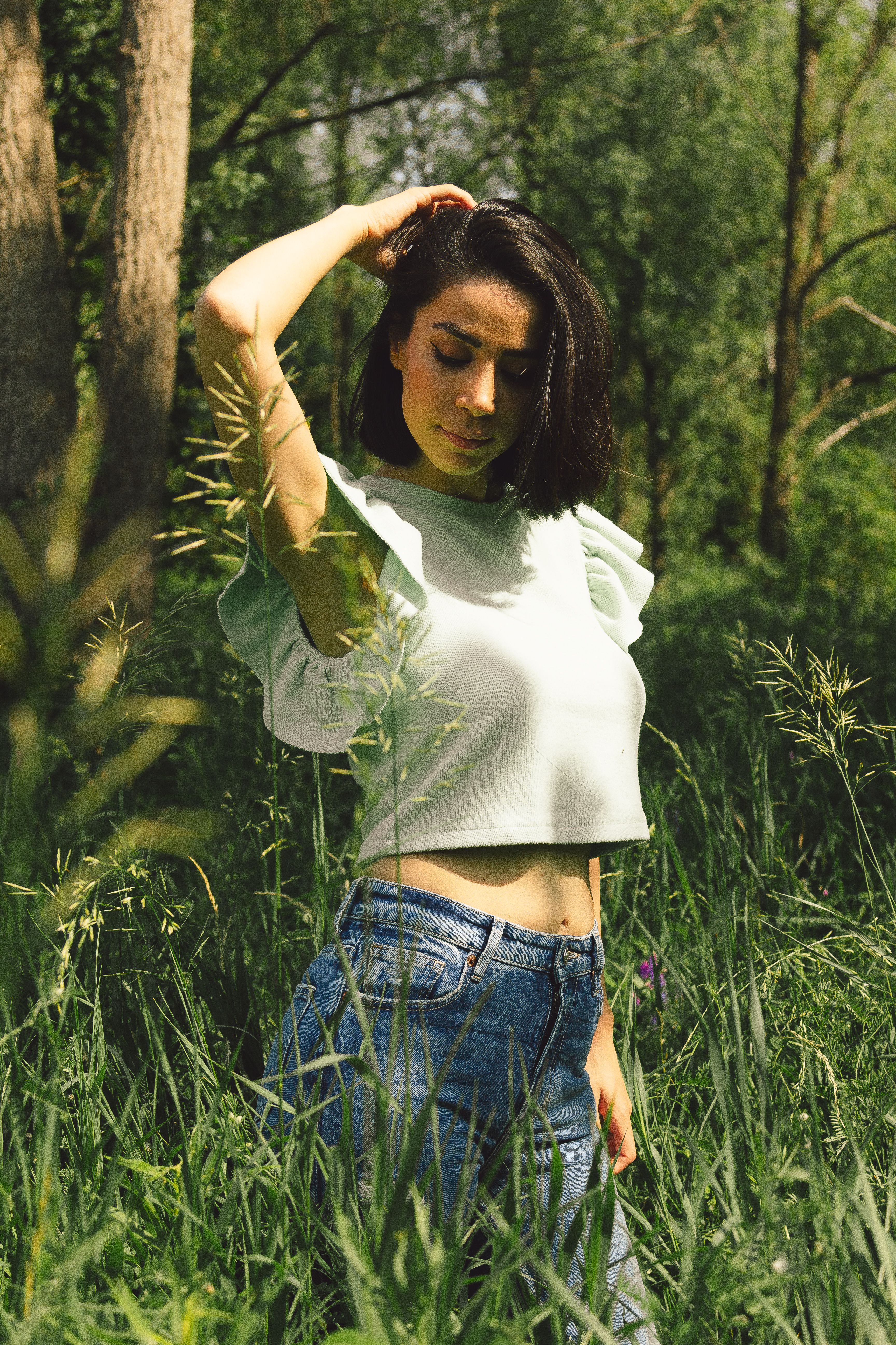 A Woman Standing on the Grass · Free Stock Photo