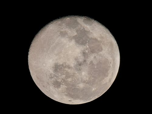 Free Detailed full moon captured in a clear night sky over Huila, Colombia. Stock Photo