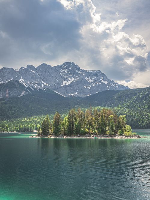 Free Peaceful view of a lake surrounded by mountains and forest in Grainau, Germany. Stock Photo