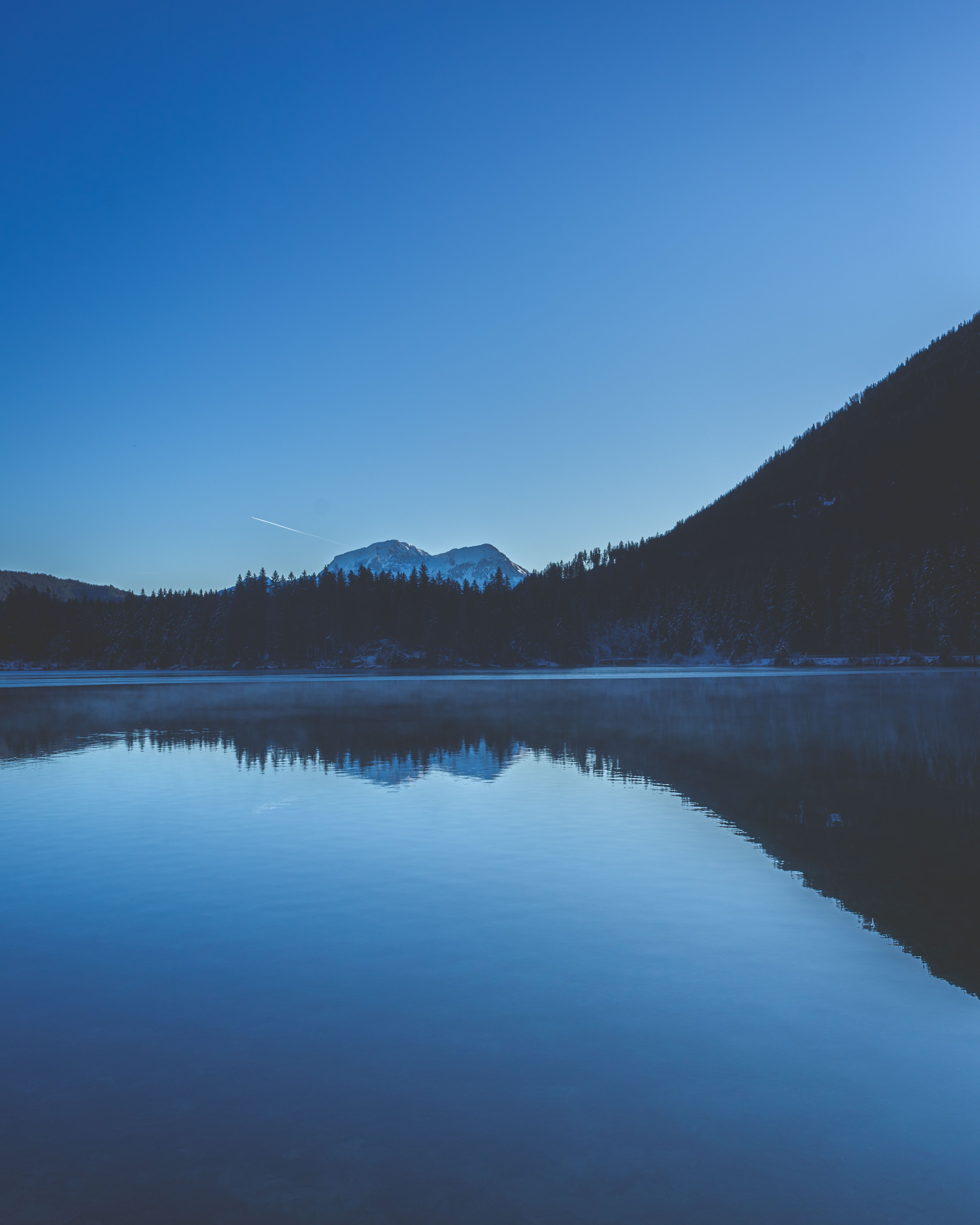 Lake Near Mountain Under Clear Blue Sky · Free Stock Photo