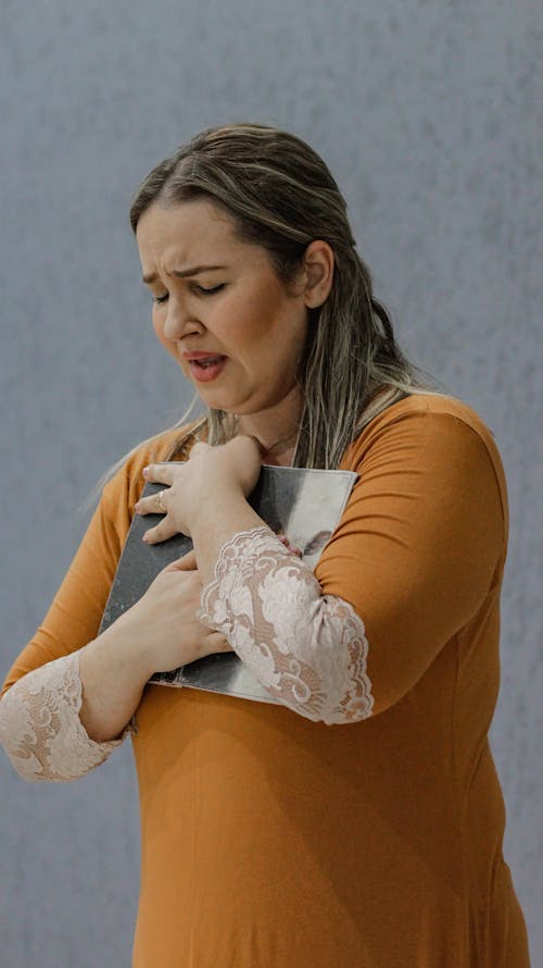 Grieving woman hugging an Object 