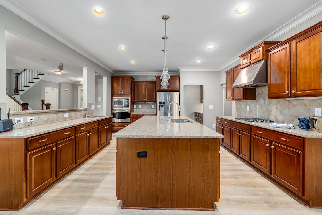 Free Wooden Cabinets on House Kitchen Stock Photo