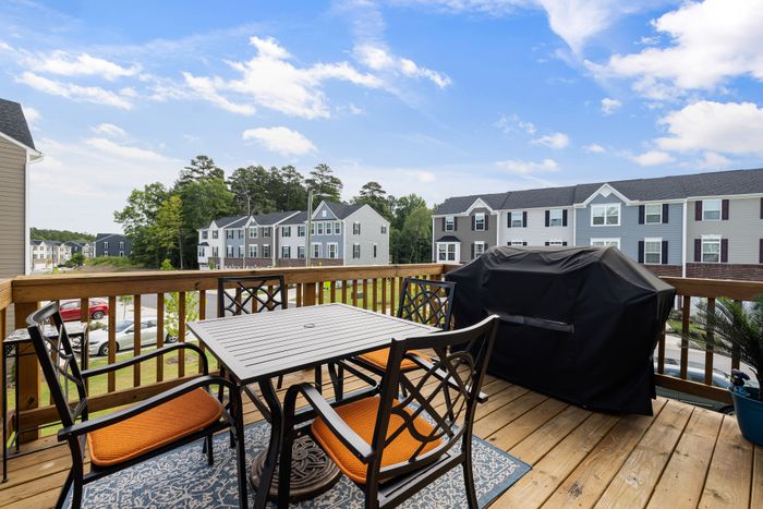 Residential wooden deck with outdoor furniture