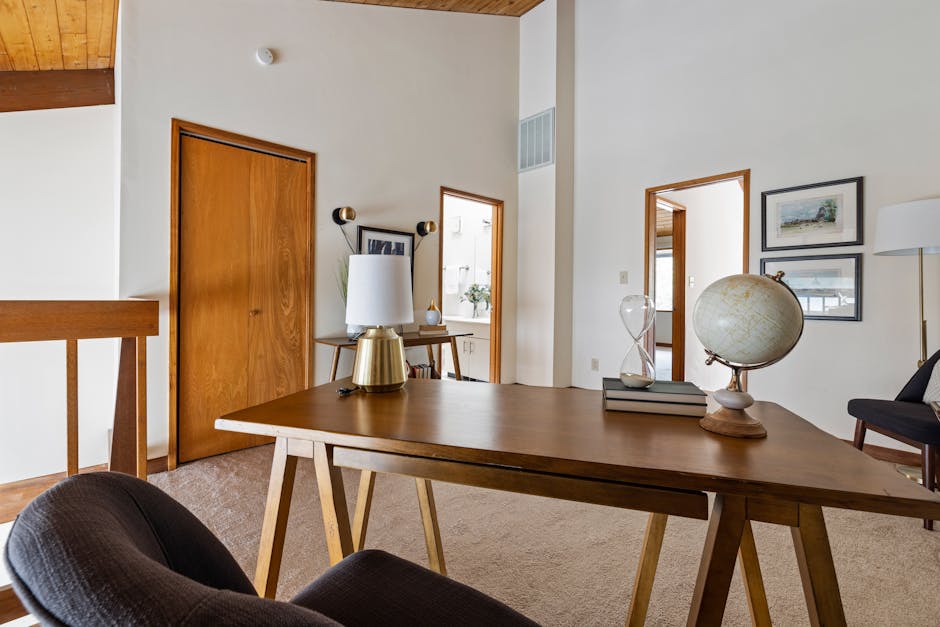 Maintaining a Clean Office Environment Montreal 2 MAINTAINING A CLEAN OFFICE ENVIRONMENT MONTREAL - COZY HOME OFFICE INTERIOR WITH WOODEN DESK, CHAIR, AND DECOR ITEMS LIKE GLOBE AND SAND GLASS.