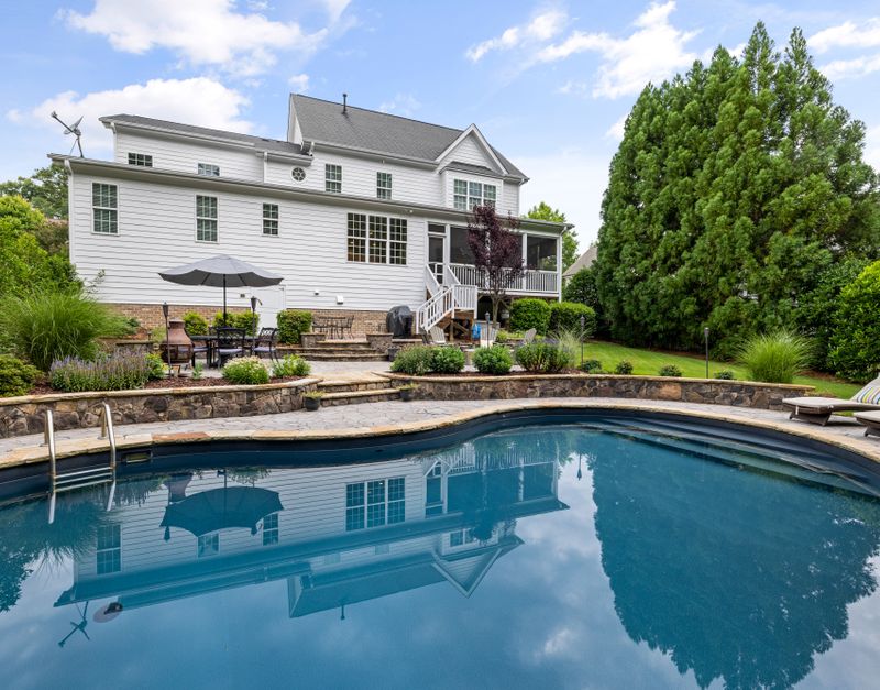 Suburban house with a pool and landscaped garden