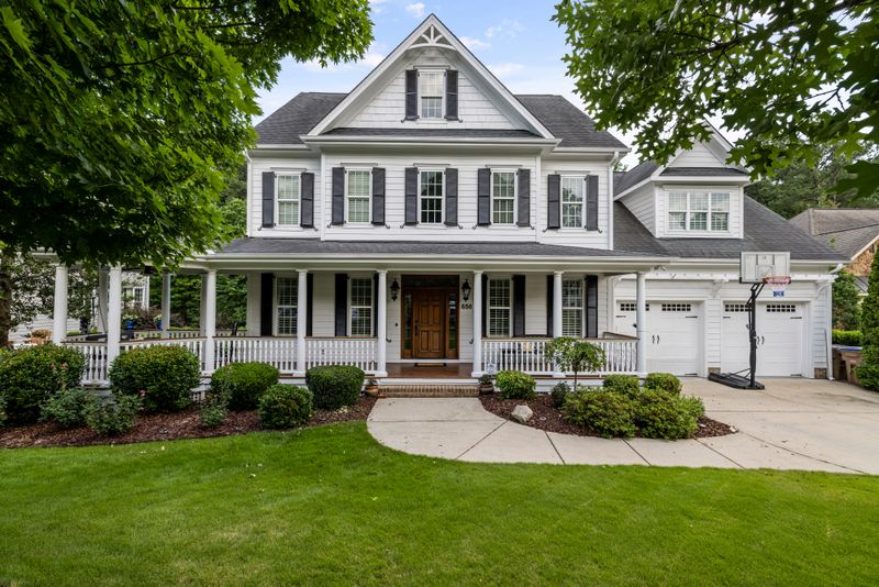 Charming white home exterior behind a first time buyer testimonial