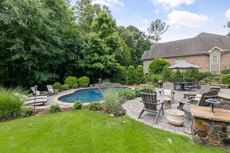 Pool And Furniture At House Exterior