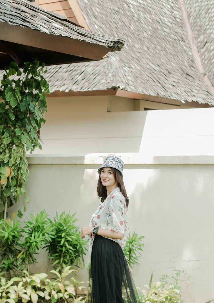 Woman Posing In Suburban House Garden