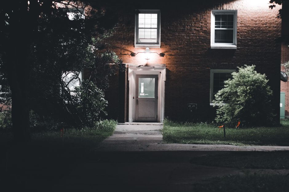 Beautifully illuminated home exterior with landscape lighting highlighting trees, walkways and architectural features - landscape lighting methuen ma