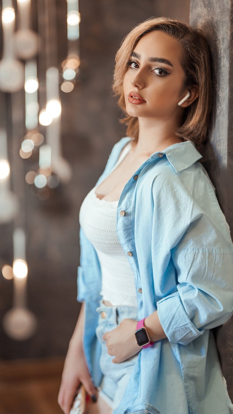 Portrait Of A Blond Woman In A Blue Shirt