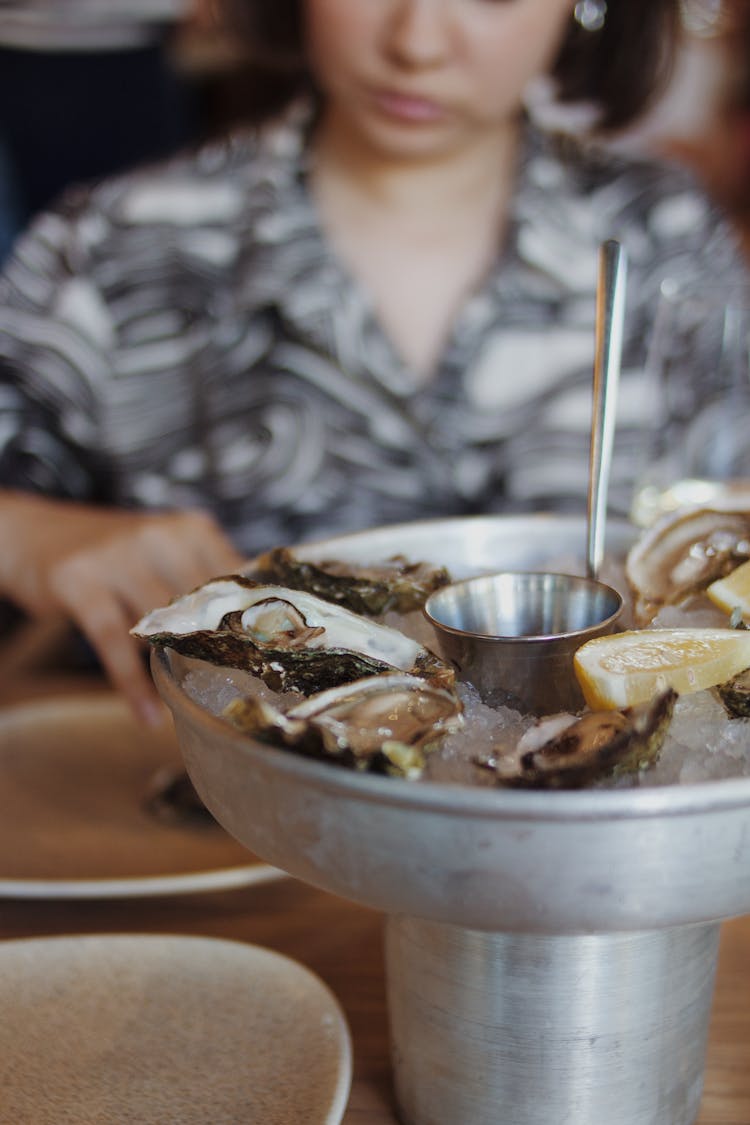 Metal Pot And Oysters In Ice In A Restaurant