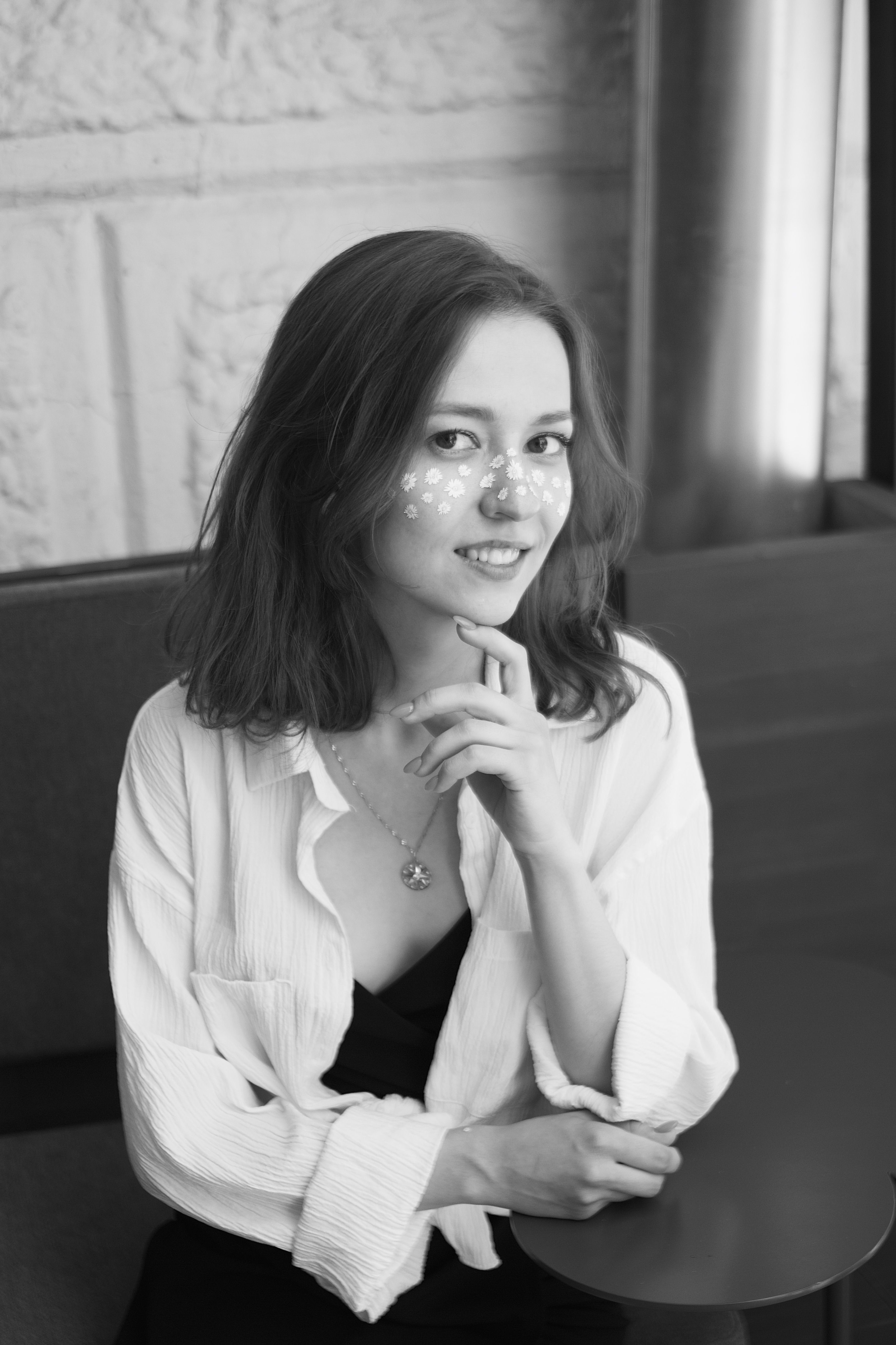 Woman in White Long Sleeve Shirt Sitting on Chair · Free Stock Photo