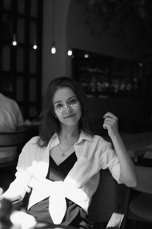 Smiling Brunette Woman in White Shirt