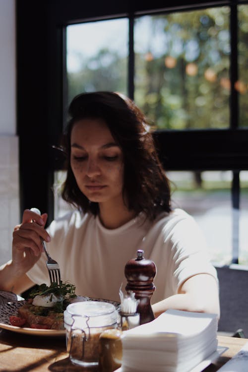A Woman Eating Food