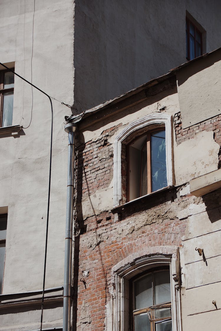 Buildings And Damaged Wall