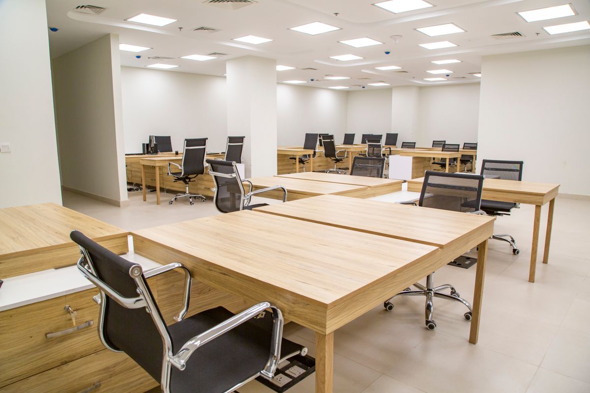 Office desks and chairs in a workspace