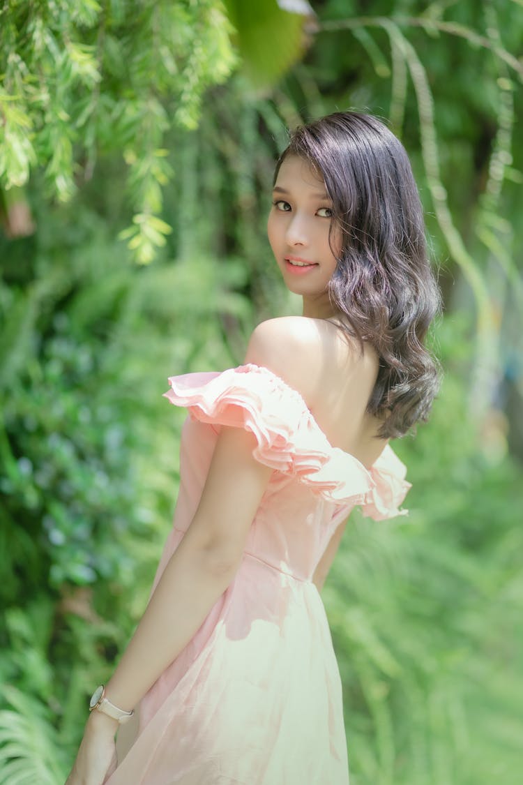 Beautiful Woman In Dress Posing In Park