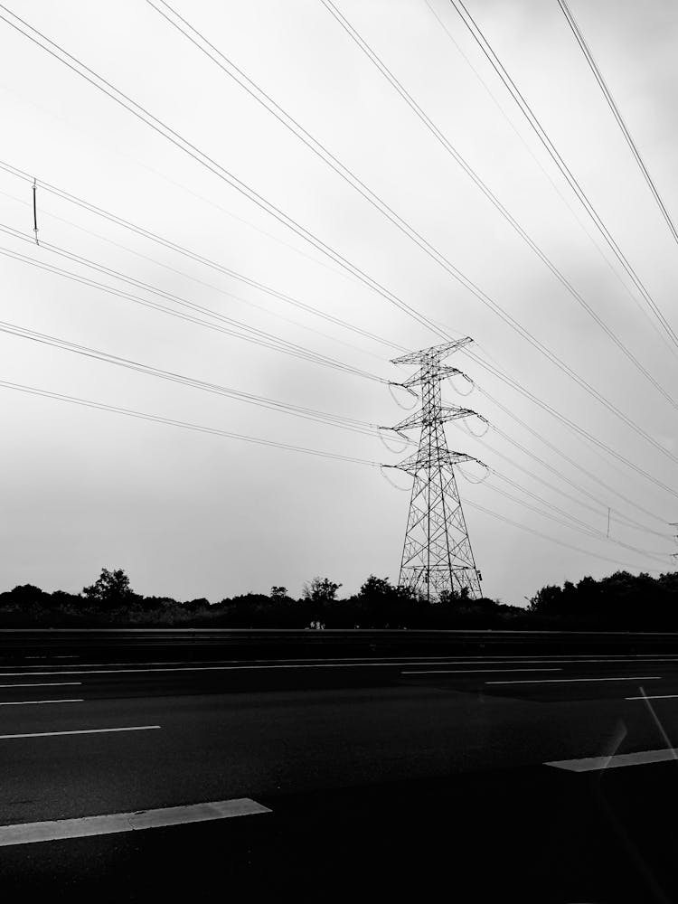 A Grayscale Of An Overhead Power Line