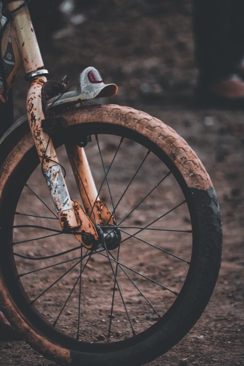 Free Close-up of a weathered rusty bike wheel showing texture and age. Stock Photo