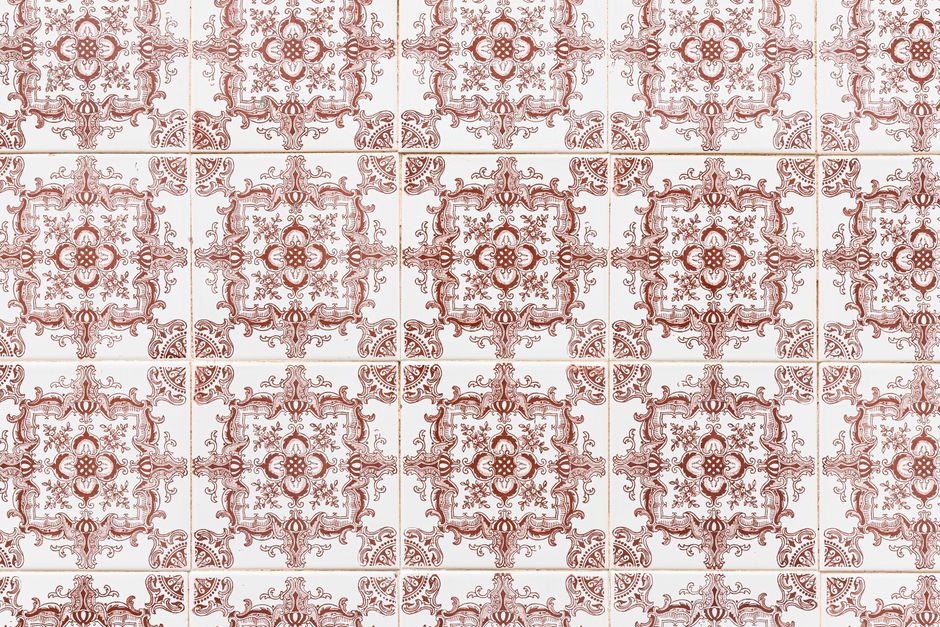 Close-up of ornate ceramic tiles with intricate design in Faro, Portugal, highlighting traditional craftsmanship.