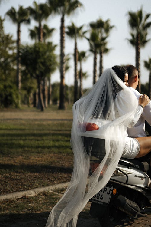 Bride and Groom Riding Motorbike
