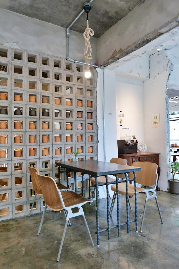 Restaurant Table Under Concrete Wall