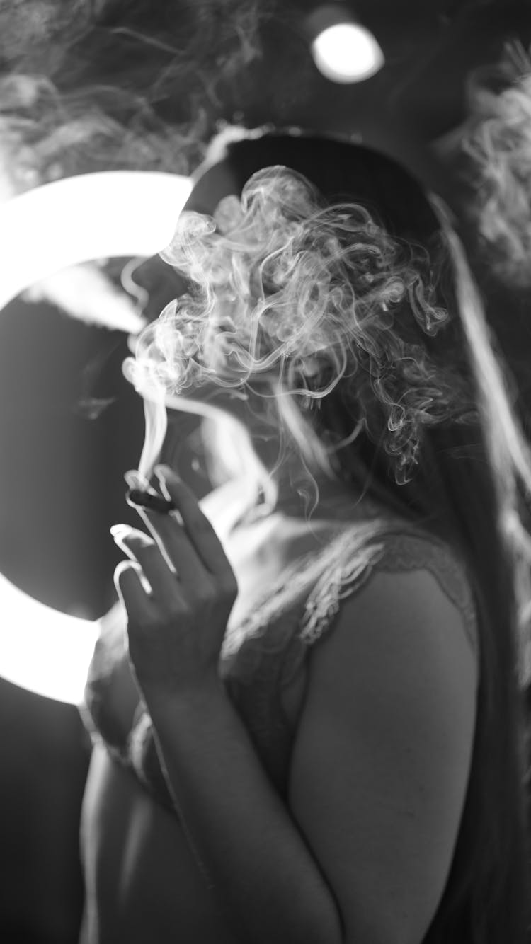 A Woman Smoking A Blunt