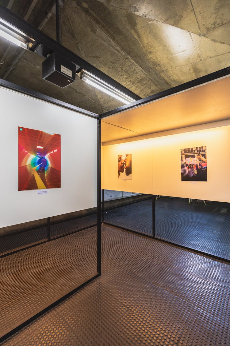 Photographic Exhibition In A Gallery With Concrete Ceiling