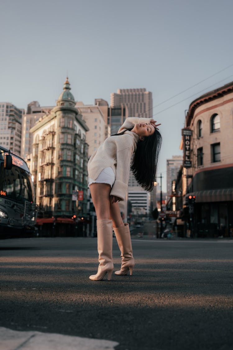 Woman Posing On A Street Bending Back