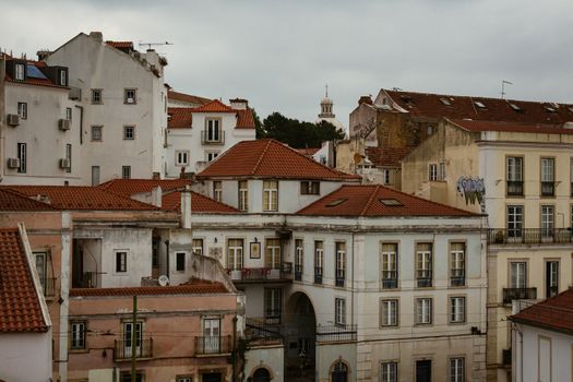 A beautiful view of traditional Lisbon buildings with terracotta roofs, showcasing classic Portuguese architecture.