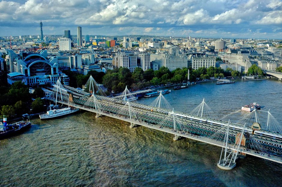 A stunning aerial view of London's skyline featuring bridges and the bustling cityscape.